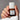 Kure Bazaar Colour Repairing Serum Nail Polish Le Rose 05 on a model's nails, holding the bottle