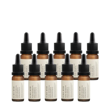ten amber glass dropper bottles with black caps and cream labels, arranged in two rows on a plain white background. The labels read ALPA MOM PURE BOTANICAL CONCENTRATE.