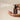 Hand holding John Masters Scalp Follicle Treatment & Volumizer and spraying mist