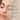 Model's face and the benefits of Kiki Health Organic Castor Oil for skin