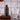 Kiki Health Ionic Electrolytes Mineral Concentrate being decanted into a glass of water