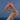 Foot holding up Le Rub All Day Body Sunscreen SPF50 with a backdrop of blue sky