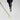 Bottle dripping drops of Madara Scalp Peel Serum onto a plant on grey background