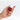 Kure Bazaar Sienna Nail Polish on a model's nails, holding the bottle