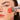 Ere Perez Eco Vegan Retractable Kabuki Brush applying blush to face