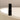 Bottle of Inlight Lip Serum sitting on side of bath