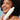Model holding bottle of Innersense Clarity Hairbath Shampoo