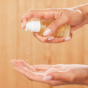 Innersense Hair Renew Scalp Oil being pumped into hands
