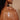 Swatch of the white lotion of Innersense Renew Body Lotion on model's shoulder