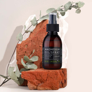 Kiki Health Magnesium Oil Spray with plants in the background