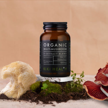 Kiki Health Organic Multi-Mushroom Extract Blend with mushrooms and plant background