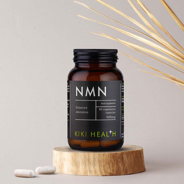 Kiki Health NMN Capsules - NAD+ Booster with plant background