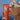 Model kissing the tube of Le Rub All Day Body Sunscreen SPF50 outside in the sun