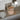 Open jar of Mirror Water Soak Bath Salts sitting in a bathroom on the edge of a bath with grey tiles