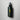Flat lay of bottle of Madara Silk Micro-Keratin Healthy Hair Mist on grey background