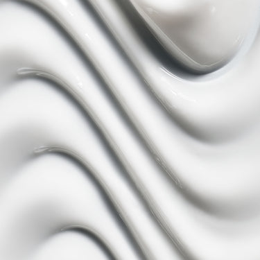 Close-up swatch of Manasi 7 Microbioskin Botanical Body Cream Calantha cream texture