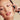 Model holding bottle of Odacite All Embracing Serum against face