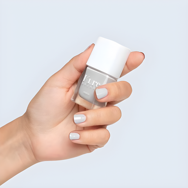 Kure Bazaar Mineral Nail Polish shown on a hand